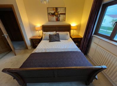 Beautiful Queen Sized solid sleigh mahogany bed