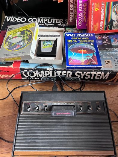 Atari 2600 Space Invaders Woody Atari 2600 with 15 individual games and 14 game Indy 500 driving