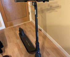 Ninebot E2 scooter with a helmet