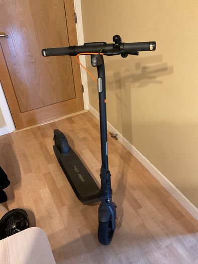 Ninebot E2 scooter with a helmet