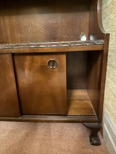 Mahogany bookcase with sliding doors and claw and ball feet