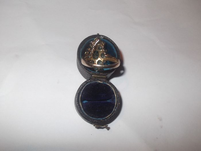 a silver dress ring with white stones  and a green stone stamped 925 china