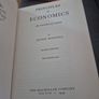 An original hardcover printing of Alfred Marshalls Principles of Economics eighth Edition published by Macmillan Image 2