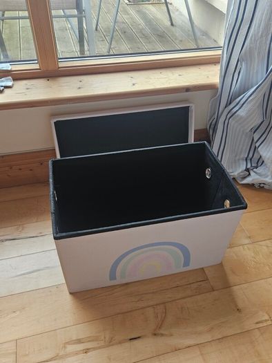 Storage box with a rainbow design