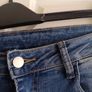 Mid-wash Distressed Jeans with Cuffed Hem. Image 3
