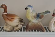 4 different bird ornaments