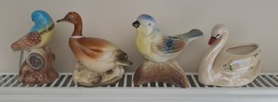 4 different bird ornaments