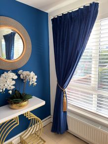 velvet navy curtains in mint conduction with lining.