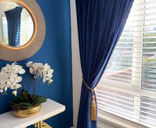 velvet navy curtains in mint conduction with lining.