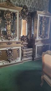 Massive old double vitrine and mirror