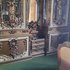 Massive old double vitrine and mirror