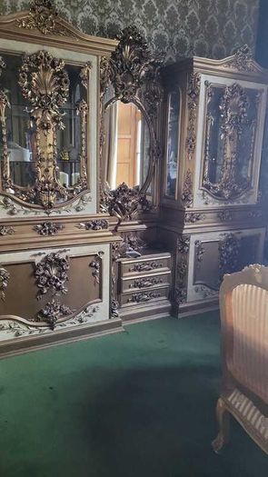 Massive old double vitrine and mirror