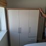 Timer and white wardrobe and bedside locker Image 2