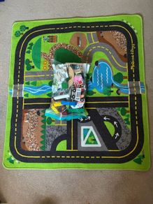 wooden toy town and rug