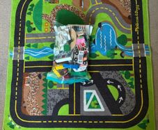 wooden toy town and rug