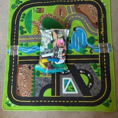 wooden toy town and rug