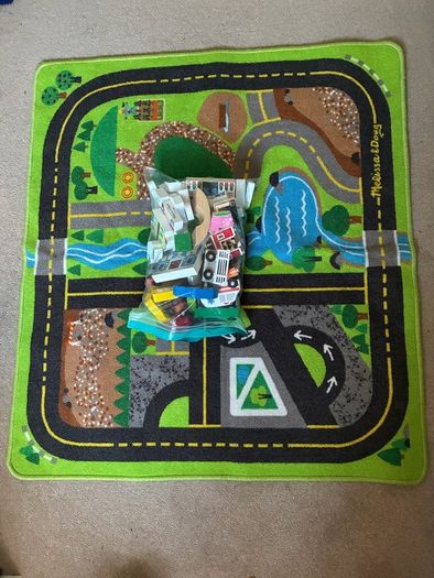 wooden toy town and rug