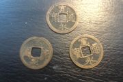 3 Japanese copper coins
