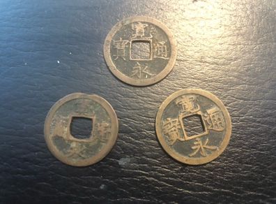 3 Japanese copper coins