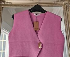Brand new sleeveless cardigan