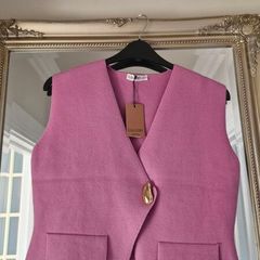 Brand new sleeveless cardigan