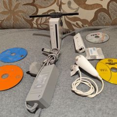 Nintendo Wii with 4 loose discs and HDMI adapter