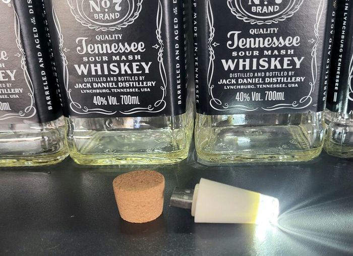 10 empty Jack Daniel bottles
