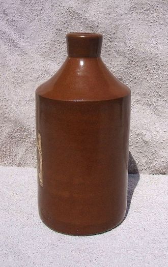 Stoneware antique ink bottle (large size 7.5" high) - made by Joseph Bourne of Denby (1880's - 1910's). Superb condition with remnants of label.
