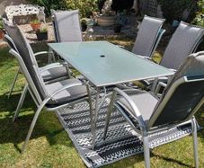 garden table with 6 chairs including cushions which are in perfect condition