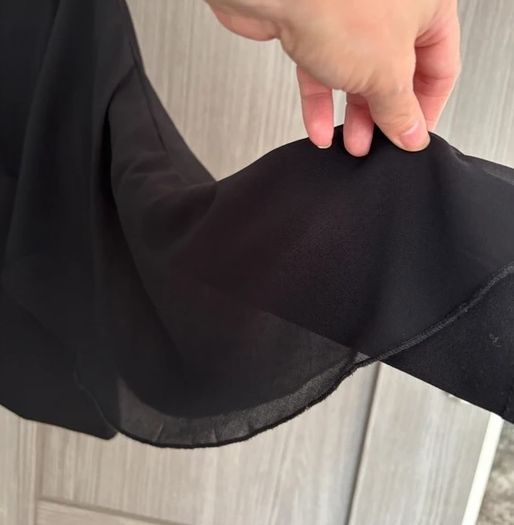 Top with cape-style overlay
