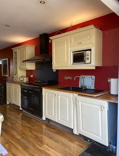 Kitchen + Island + Solid Oak Countertops + Integrated Dishwasher + black sink & gold mixer tap