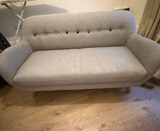 Grey Sofa with multicoloured buttons