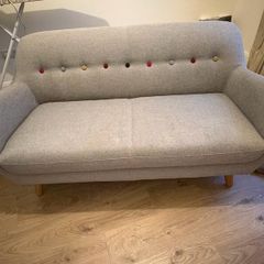Grey Sofa with multicoloured buttons