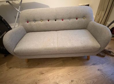 Grey Sofa with multicoloured buttons