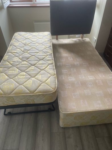 Single bed frame with guest mattress and headboard