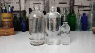 333 - Set of 3 Vintage Clear Glass Collectible Decorative Ribbed Bottles