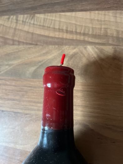 Candle shaped like a bottle of wine