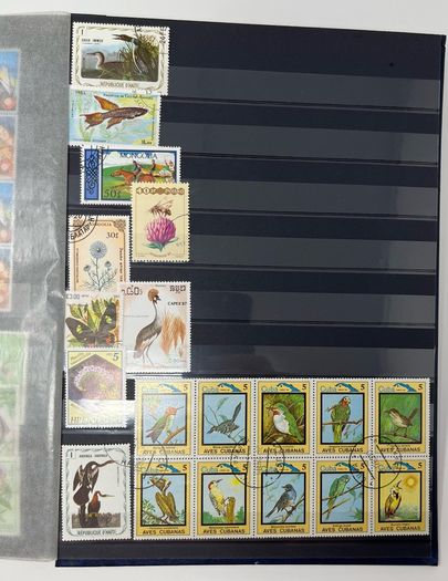 Ace Black 32 page/ 16 leaf Stamp Album with over 900 stamps. Thematic of Animals, Plants, Classic Cars, Space, Trains, Sport & Disney noted.