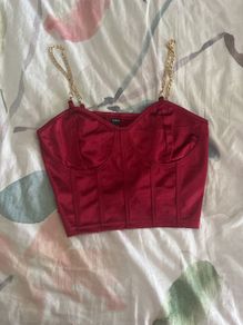 Red corset top with gold chains
