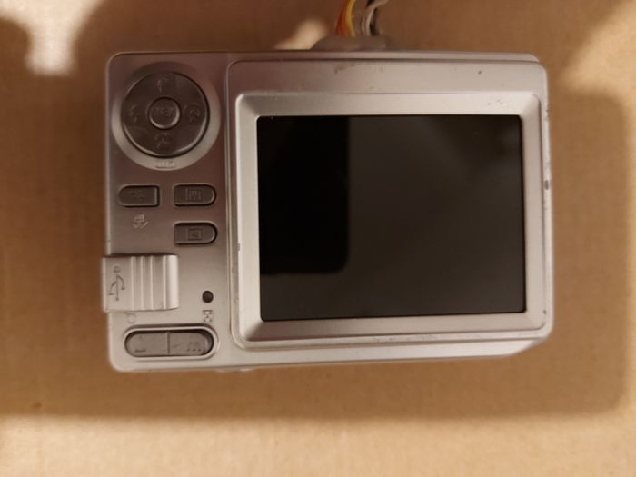 Z880 Digital Camera, Takes 2AA Batteries, working fine, has a modification that doesn't affect its performance