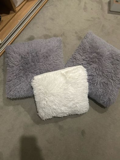 3 fluffy cushions