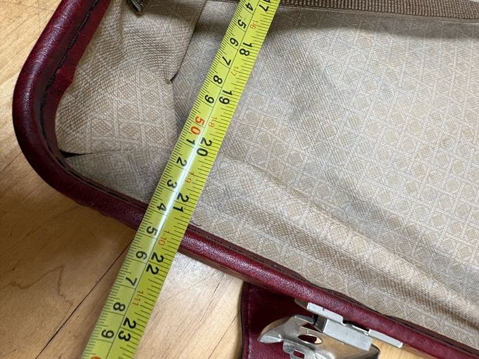 Vintage burgundy faux-leather suitcase