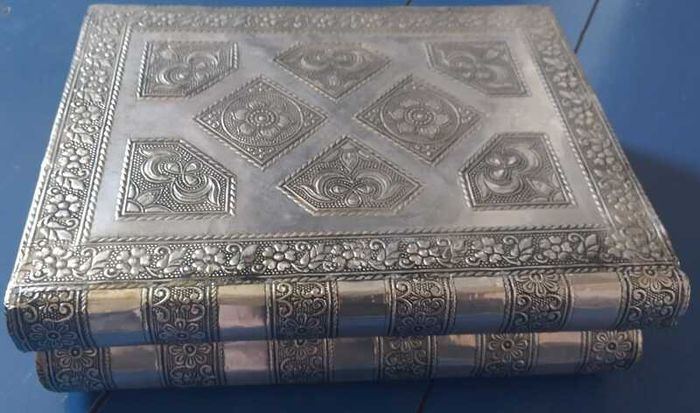Book-shaped silver jewellery box with purple velvet lining