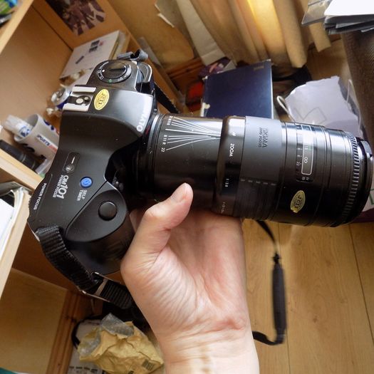 Old heavy Olympus OM101 Camera with lens.