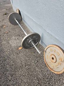 barbell and 4 15kg steel weights
