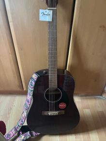 Fender guitar and Dunlop strap