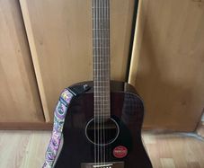 Fender guitar and Dunlop strap