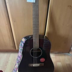 Fender guitar and Dunlop strap