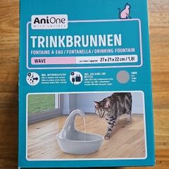Cat drinking fountain