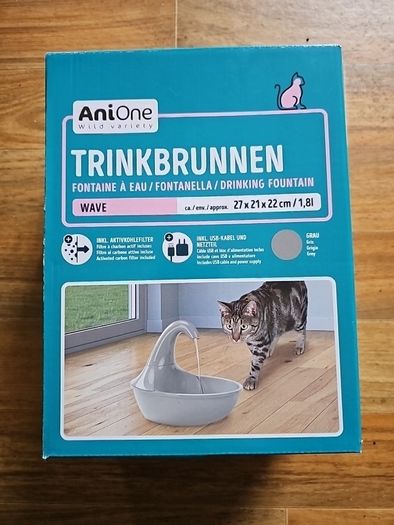 Cat drinking fountain